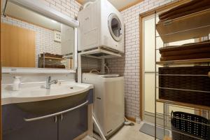 a small kitchen with a sink and a microwave at Total 107square meter 4min to nearest staion Max16pp in Tokyo +34 photos