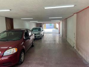 two cars parked in an empty parking garage at San José in Orizaba
