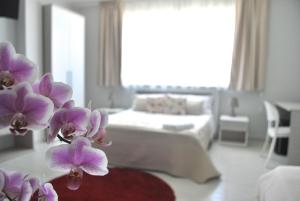 Postel nebo postele na pokoji v ubytování Pietra Bianca Rooms