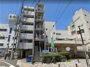 a tall building with a staircase in front of it at AirStay Horikiri 301 - Vacation STAY 45405v in Tokyo