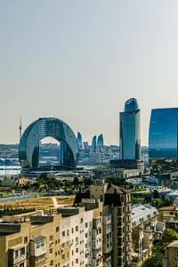 a view of a city with tall buildings at Baku Sea View 3 bedroom in Baku