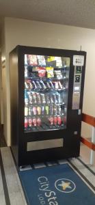 a vending machine in a store with drinks in it at City Star Lodge in Brisbane