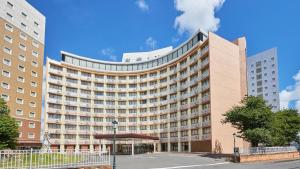a large building with a lot of windows at Toyoko Inn Narita Airport Honkan in Narita