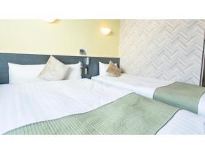 Postel nebo postele na pokoji v ubytování Hotel Areaone Okayama - Vacation STAY 32495v