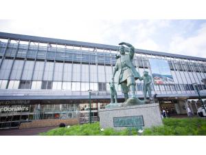 a statue in front of a large building at Hotel Areaone Okayama - Vacation STAY 32493v in Okayama