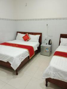 Postel nebo postele na pokoji v ubytování Khách sạn Mộng An