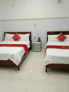 Postel nebo postele na pokoji v ubytování Khách sạn Mộng An