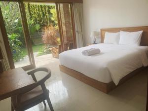 Postel nebo postele na pokoji v ubytování Kakol Homestay