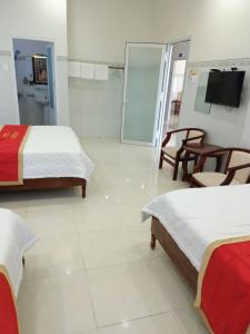 Postel nebo postele na pokoji v ubytování Khách sạn Mộng An