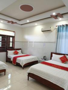 Postel nebo postele na pokoji v ubytování Khách sạn Mộng An