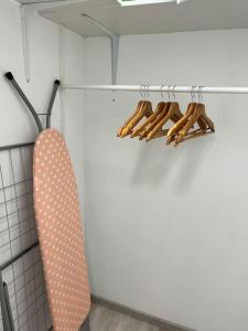 a polka dot tie hanging on a rack in a kitchen at EG-Souterrain Wohnung in Marburg an der Lahn