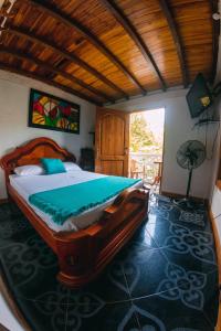 Postel nebo postele na pokoji v ubytování Hostal Vista Hermosa