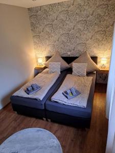 a living room with two beds in a room at Meerhuuske Käthe in Südbrookmerland