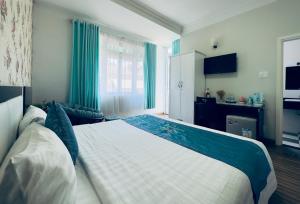 Postel nebo postele na pokoji v ubytování Dalat Eco Hotel