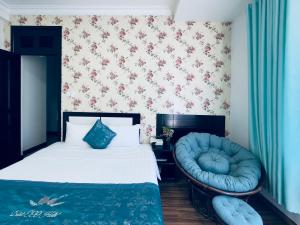 Postel nebo postele na pokoji v ubytování Dalat Eco Hotel