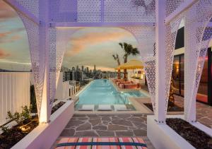 a swimming pool on the roof of a building at Rambla at South City SQ in Brisbane