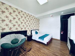 Postel nebo postele na pokoji v ubytování Dalat Eco Hotel