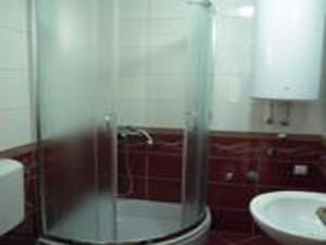 a bathroom with a glass shower and a sink at Studios Ravlić Marija in Makarska +59 photos