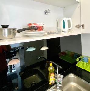 a kitchen with a sink and a counter top at MUJI style 2人名宿, Landmark Residence 2, Corner unit, High floor, Free Wi-Fi, Kajang, c180 in Kajang