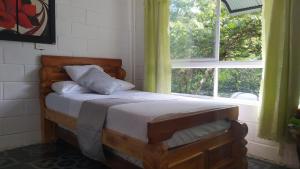 Postel nebo postele na pokoji v ubytování Hostal Vista Hermosa