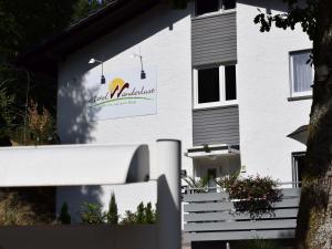 a building with a sign on the side of it at Hotel Wanderlust B&B in Gernsbach