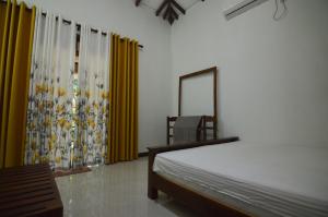 Postel nebo postele na pokoji v ubytování Binara Home Stay
