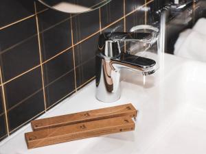 a bathroom sink with a faucet on a counter at ibis Almaty Jetisu in Almaty