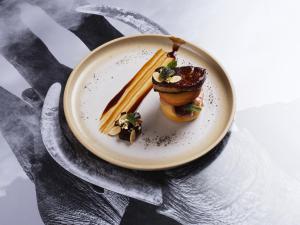 a plate of food on a table with food on it at BASK Gili Meno in Gili Meno