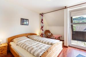 Postel nebo postele na pokoji v ubytování Am Ginsterkopf
