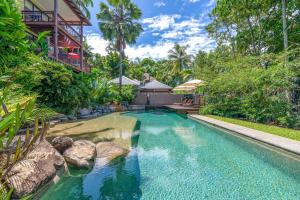 an image of a swimming pool in a resort at The Point Villa 10 in Port Douglas