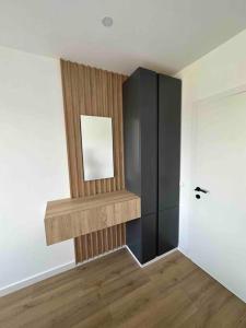 a room with a mirror on the wall and a door at U-sleep : appartement 2 chambres in Liège +4 photos