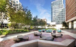 a courtyard with chairs and tables in a city at Back Bay 2br w gym nr Prudential Center BOS-299A in Boston