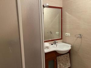 a bathroom with a sink and a mirror at Close to Sierra Nevada Casa Con Chimenea y Parking Las Golondrinas in Güéjar-Sierra +44 photos