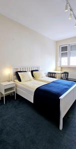 Posteľ alebo postele v izbe v ubytovaní Apartament 52 City Center