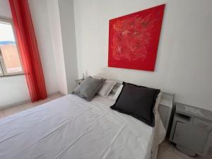 A bed or beds in a room at Casa Viola di Maria Gabriella, San Vito a 25 minuti da Costa Rey e Villasimius