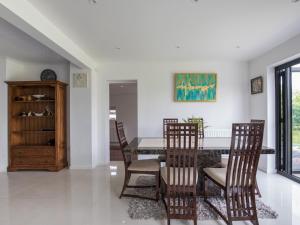 a dining room with a table and chairs at Gorgeous Family Home Near River Thames-Old Windsor - Pass the Keys in Windsor
