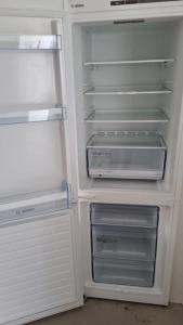 a white refrigerator with its door open with its doorsktop at Residence Gilze in Gilze