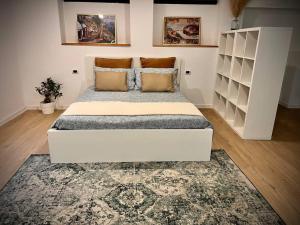 מיטה או מיטות בחדר ב-La Perla
