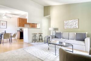 a living room with a couch and a table at Mountain View 1BR w WD Pool Gym nr groceries SFO-1067 in Mountain View