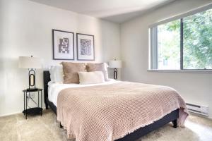 a white bedroom with a large bed with a window at Mountain View 1BR w WD Pool Gym nr groceries SFO-1067 in Mountain View +18 photos