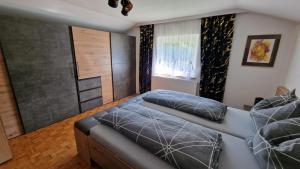 Letto o letti in una camera di s'KLINGI-Haus
