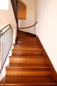 a staircase in a house with wooden floors at Hotel San Rocco in Muggia