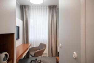 TV a/nebo společenská místnost v ubytování Wasa Historical 1938 Boutique Hotel