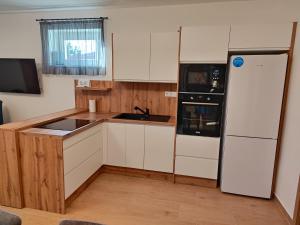 Kuchyň nebo kuchyňský kout v ubytování SzeCu Apartmanház + 15 fotografií
