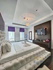 a large bedroom with a large bed with a couch at La Casa By Arabian Nights - City View - Bespoke Design in Dubai