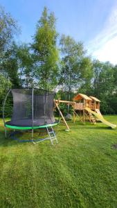 a park with two slides and a playground at Beržoro pakrantė in Berżory