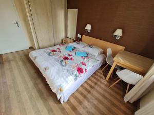 a bedroom with a large bed with flowers on it at Fantastic Waw - Z6 Room - 204A in Warsaw