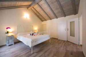 Postel nebo postele na pokoji v ubytování Plesio Rustico Panoramica