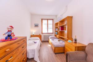 A bed or beds in a room at Carlazzo Sant' Agata Apt. 01