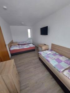 Postel nebo postele na pokoji v ubytování Penzion Strachotín